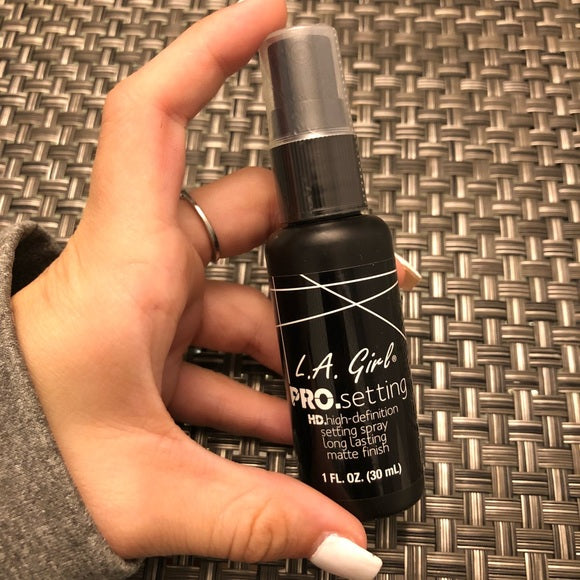 L a girl setting spray